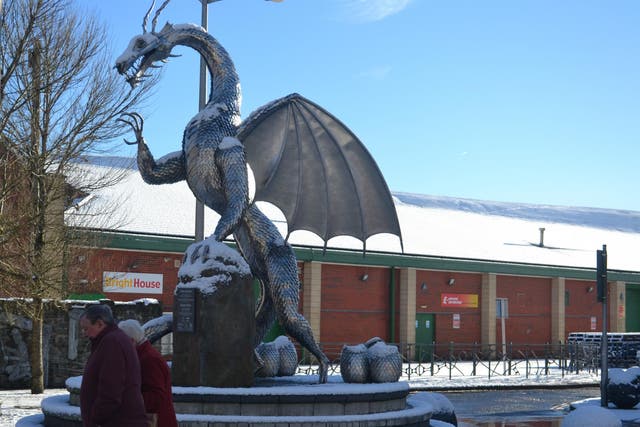 ‘Shiny ornaments in the town centre’: The EU-funded ‘Heart of the Furnace’ sculpture, with the signs for BrightHouse and Poundstretcher behind