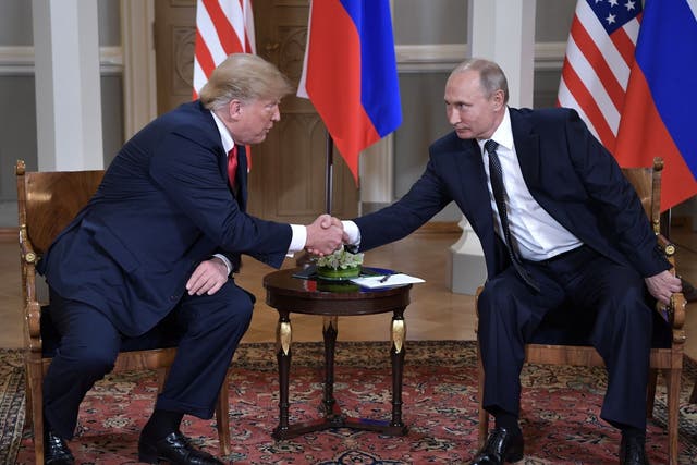 <p>Then-president Donald Trump shakes hands with Vladimir Putin in Helsinki, Finland, in 2018 </p>