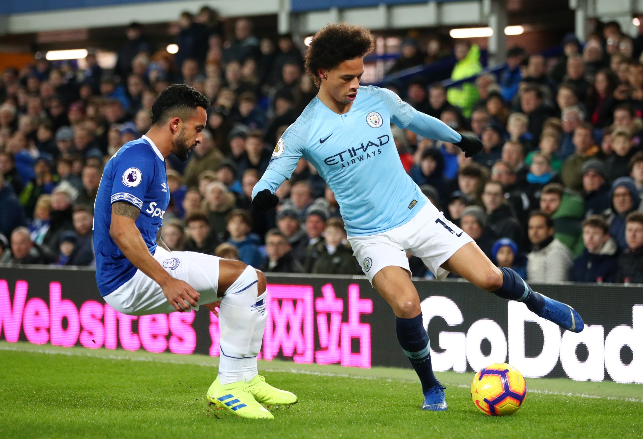 Leroy Sane takes on Theo Walcott