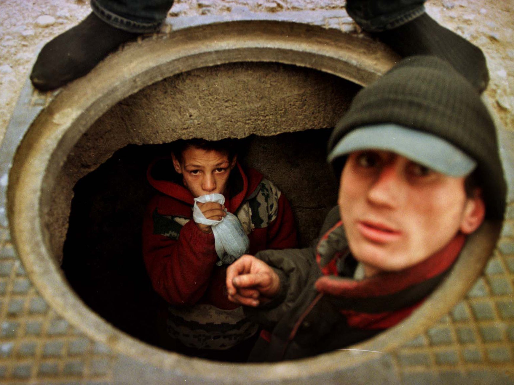 Going underground: 13-year-old Bogdan prefers to live in a Bucharest sewer than go back to the orphanage where he was beaten