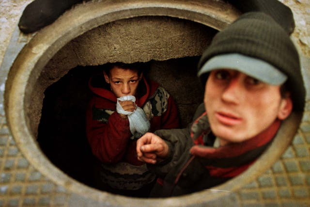 Going underground: 13-year-old Bogdan prefers to live in a Bucharest sewer than go back to the orphanage where he was beaten