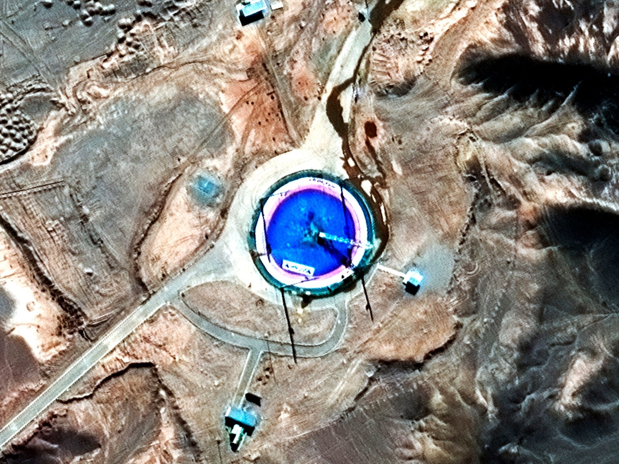 After: a day later the image shows an empty launch pad with a burn mark on it (DigitalGlobe/Maxar/AP)