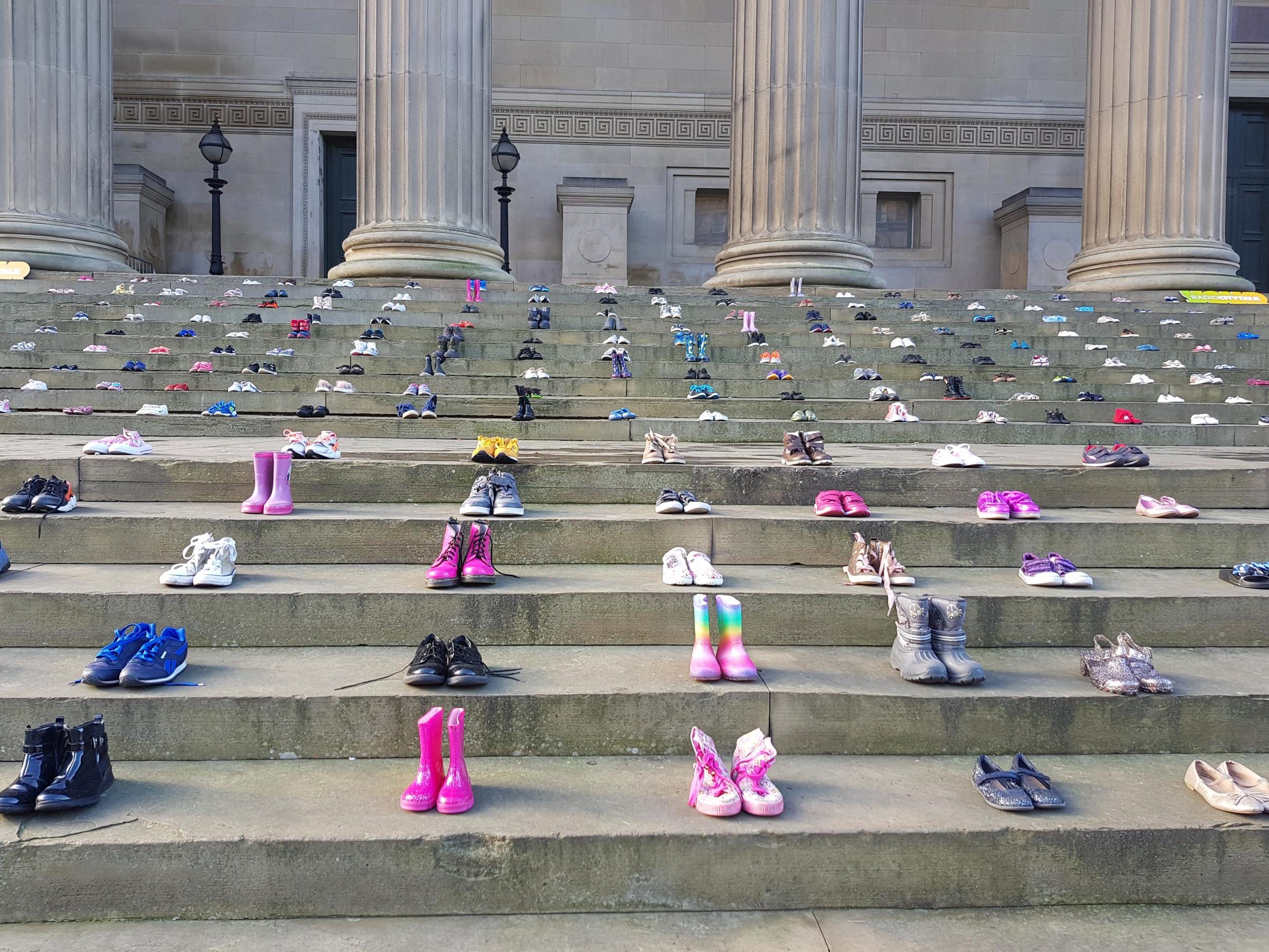 Chasing the Stigma's display of children's shoes at St George's Hall, Liverpool