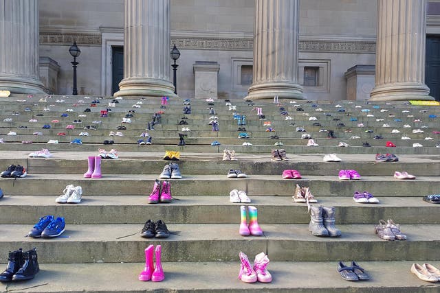 Chasing the Stigma's display of children's shoes at St George's Hall, Liverpool