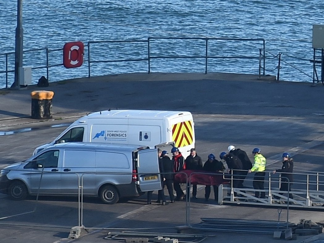 A body is taken off the Geo Ocean III, recovered from the wreckage of the plane carrying Emiliano Sala at Weymouth harbour