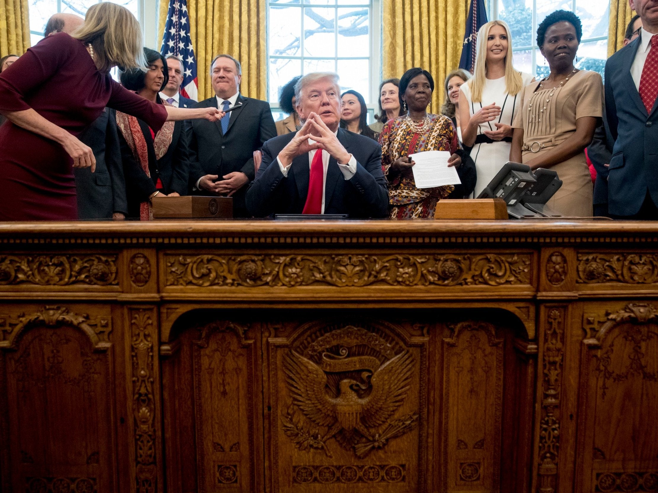 The president in the Oval Office on Thursday evening