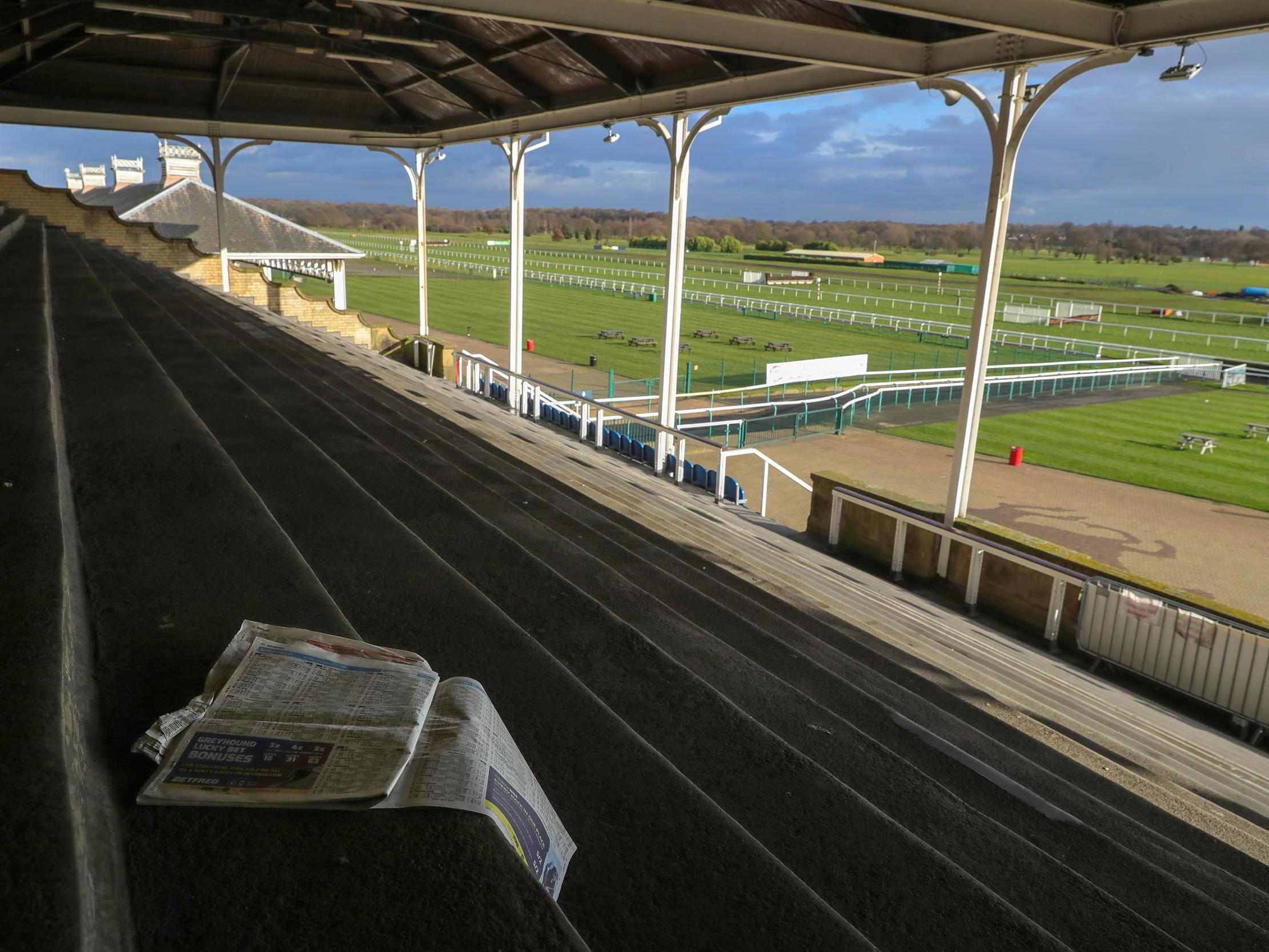 Terraces and stands remain empty after today's racing at Doncaster Racecourse was cancelled due to the equine flu outbreak