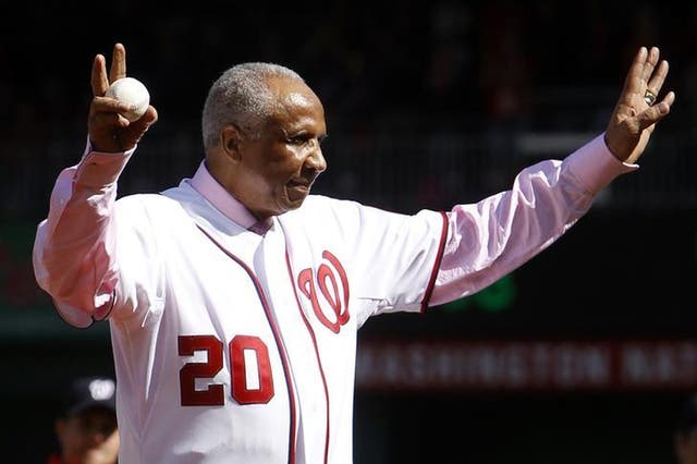 Former Washington Nationals manager Frank Robinson throws out the ceremonial first pitch before Game 3 of the MLB NLDS baseball series between the Washington Nationals and the St. Louis Cardinals in Washington 10 October, 2012.