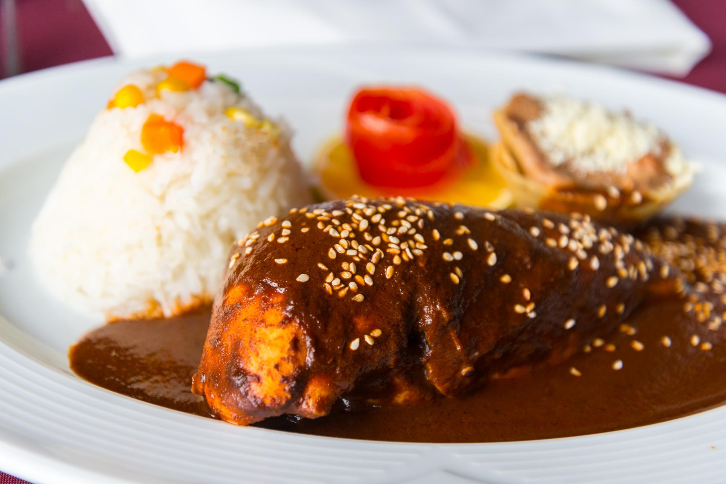 Chicken mole is made with a chocolate sauce (Stock)