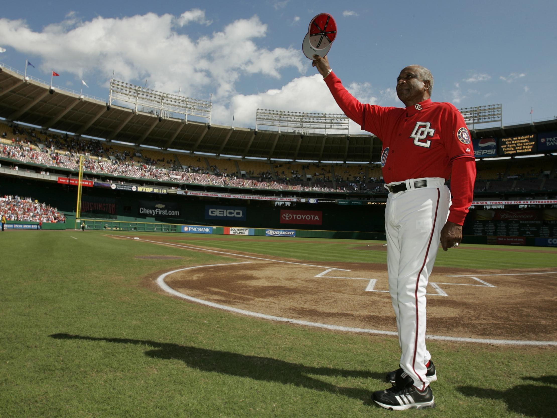 Robinson waves goodbye to Washington Nationals fans before his last game as manager in 2006