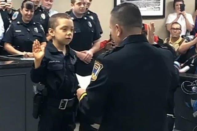 Abigal Arias is sworn in an honorary police officer