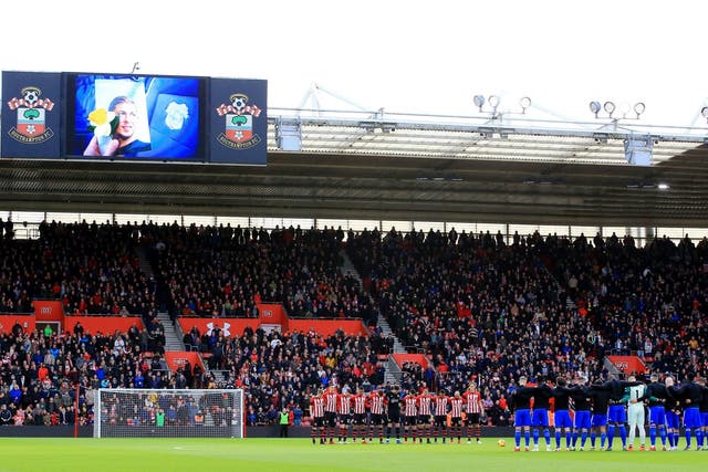 A big screen shows a tribute to the late Emiliano Sala