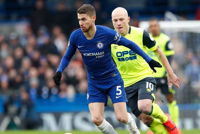 Chelsea's Jorginho and Huddersfield Town's Aaron Mooy challenge for the ball