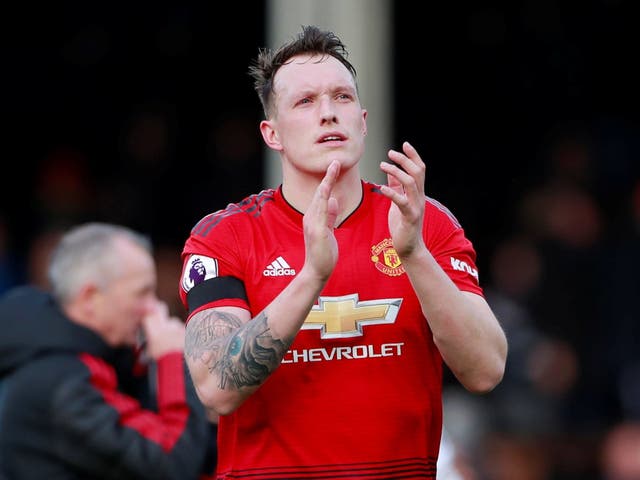 Manchester United's Phil Jones applauds fans after the match