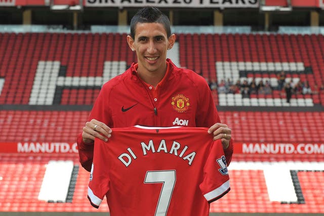 Manchester United's Angel di Maria poses with his shirt