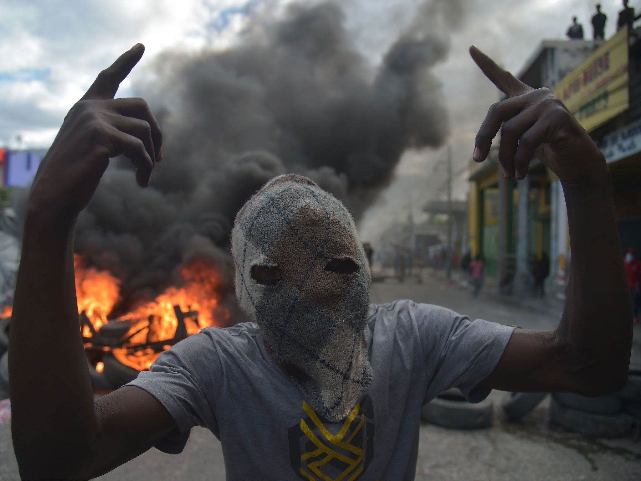 Haiti protests: Police clash with demonstrators demanding ...