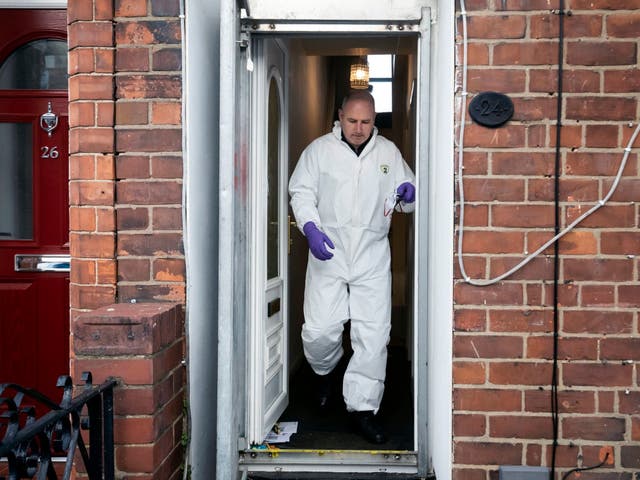 A police officer at a property on Raglan Street in Hull, after 24-year-old Pawel Relowicz was remanded in custody after appearing in court charged with unrelated offences on 11 February