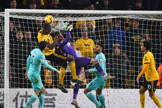 Martin Dubravka loses his battle with Willy Boly at the death