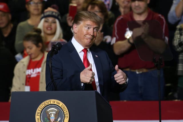 Donald Trump gestures during a campaign rally in El Paso, Texas
