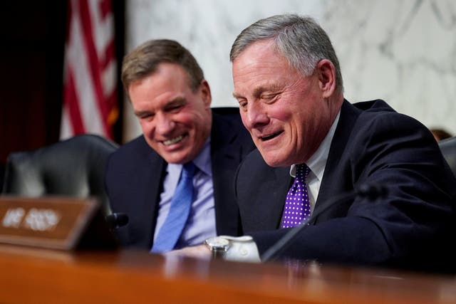 Chairman of the Senate Intelligence Committee Richard Burr and ranking member Mark Warner prepare for a hearing on Capitol Hill in Washington.