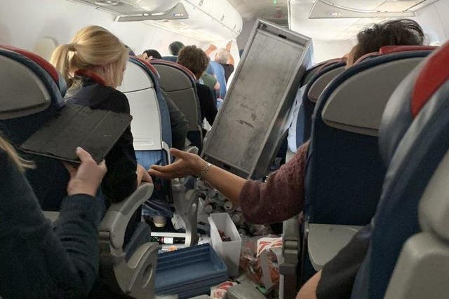 A picture taken by a passenger shows an overturned snacks trolley after "crazy turbulence" on a Delta Air Lines flight