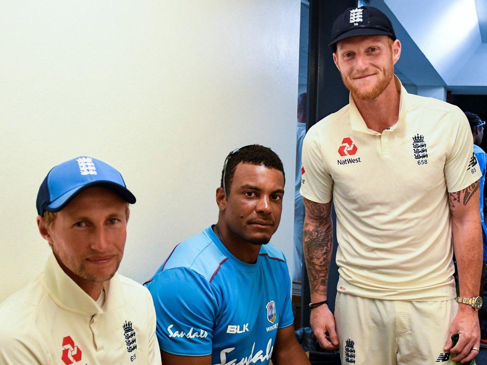 England cricketers Joe Root and Ben Stokes pictured with West Indies cricketer Shannon Gabriel
