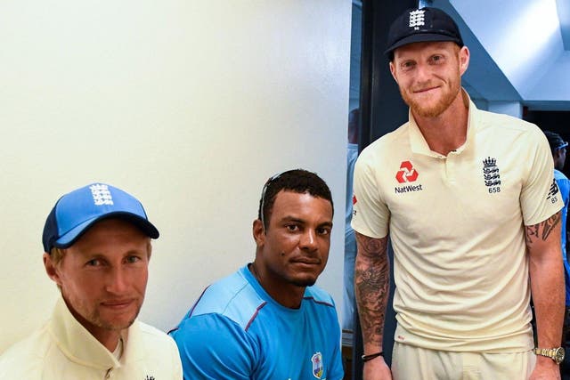 England cricketers Joe Root and Ben Stokes pictured with West Indies cricketer Shannon Gabriel