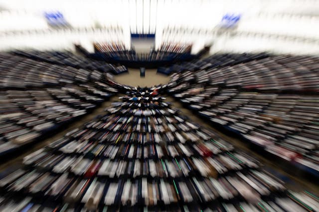 picture taken with a zoom effect shows members of Parliament vote on the EU-Singapore trade agreement  at the European Parliament in Strasbourg, France