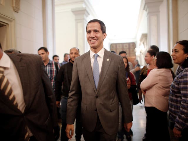 Interim president Juan Guaido smiles as he arrives at the National Assembly, in Caracas, Venezuela