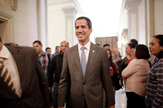 Interim president Juan Guaido smiles as he arrives at the National Assembly, in Caracas, Venezuela