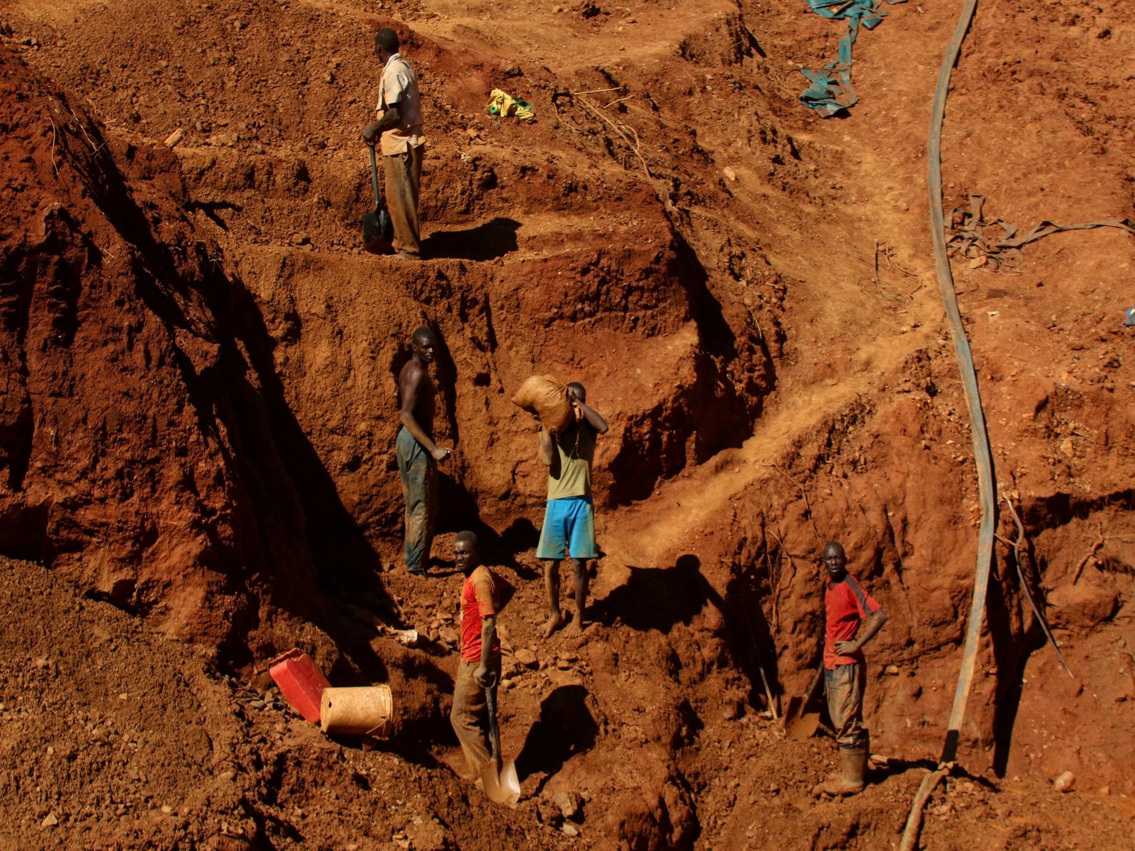 Illegal artisanal gold miners work at an open mine after occupying parts of Smithfield farm, owned by the former President Robert Mugabe's wife Grace Mugabe, in Mazowe, Zimbabwe, 5 April 2018.