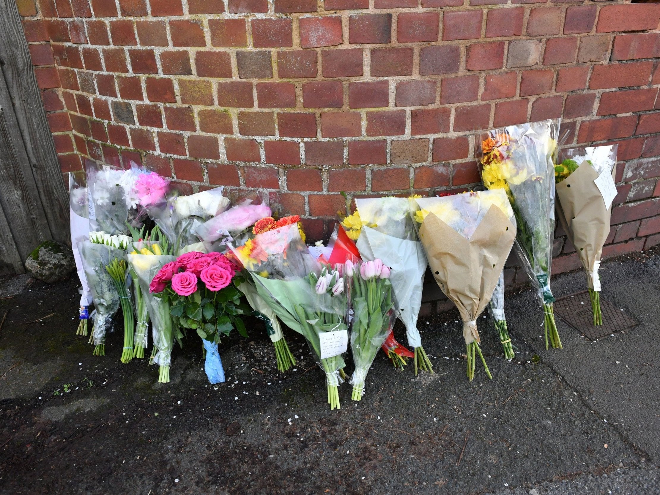 Floral tributes left on Cowick Lane, where Dick and Roger Carter were found dead