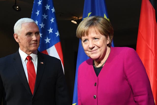 Mike Pence and Angela Merkel in Munich on Saturday