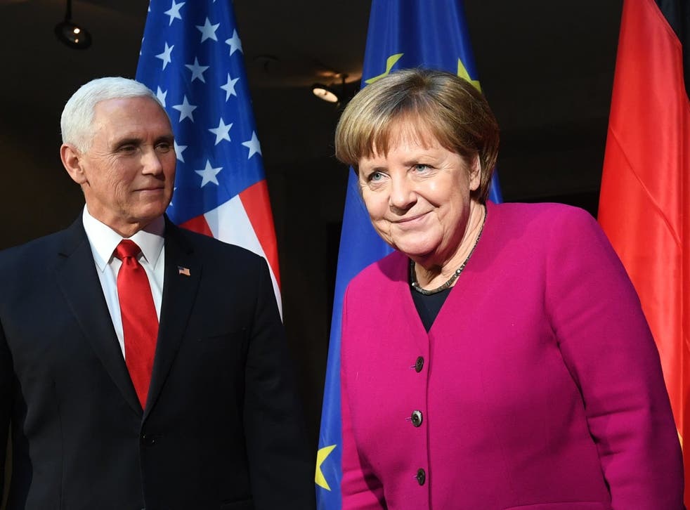 Mike Pence and Angela Merkel in Munich on Saturday