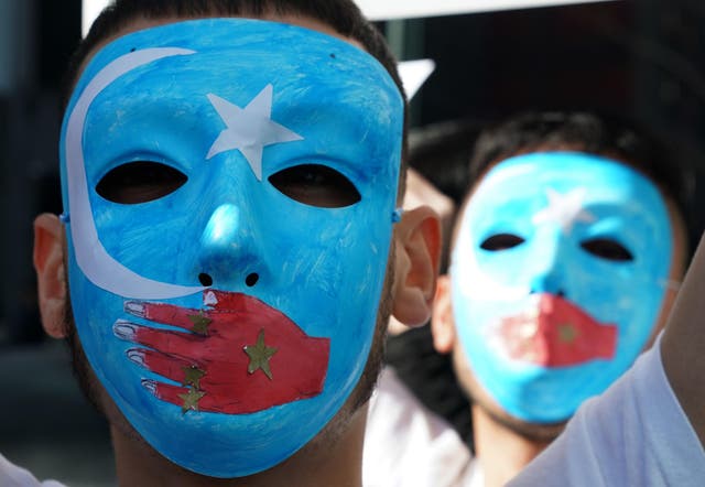 <p>Pro-Uighur protesters outside the United Nations in New York</p>