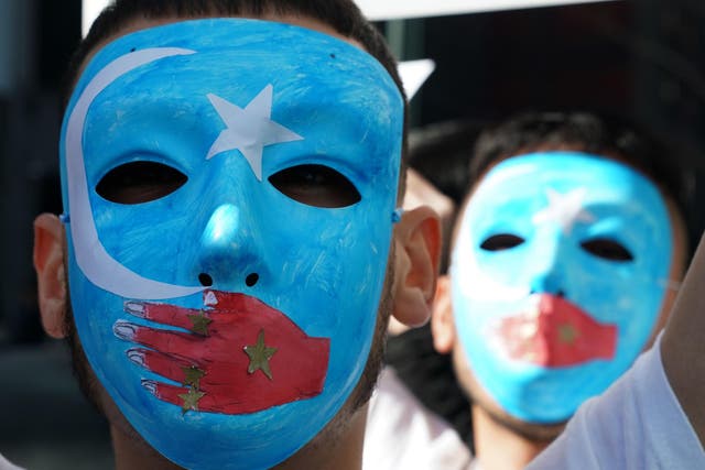<p>Pro-Uighur protesters outside the United Nations in New York</p>