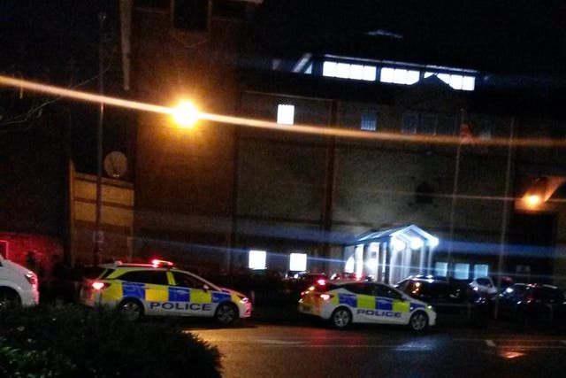 Police outside HMP Bedford, where a specialist riot unit quashed six hours of unrest