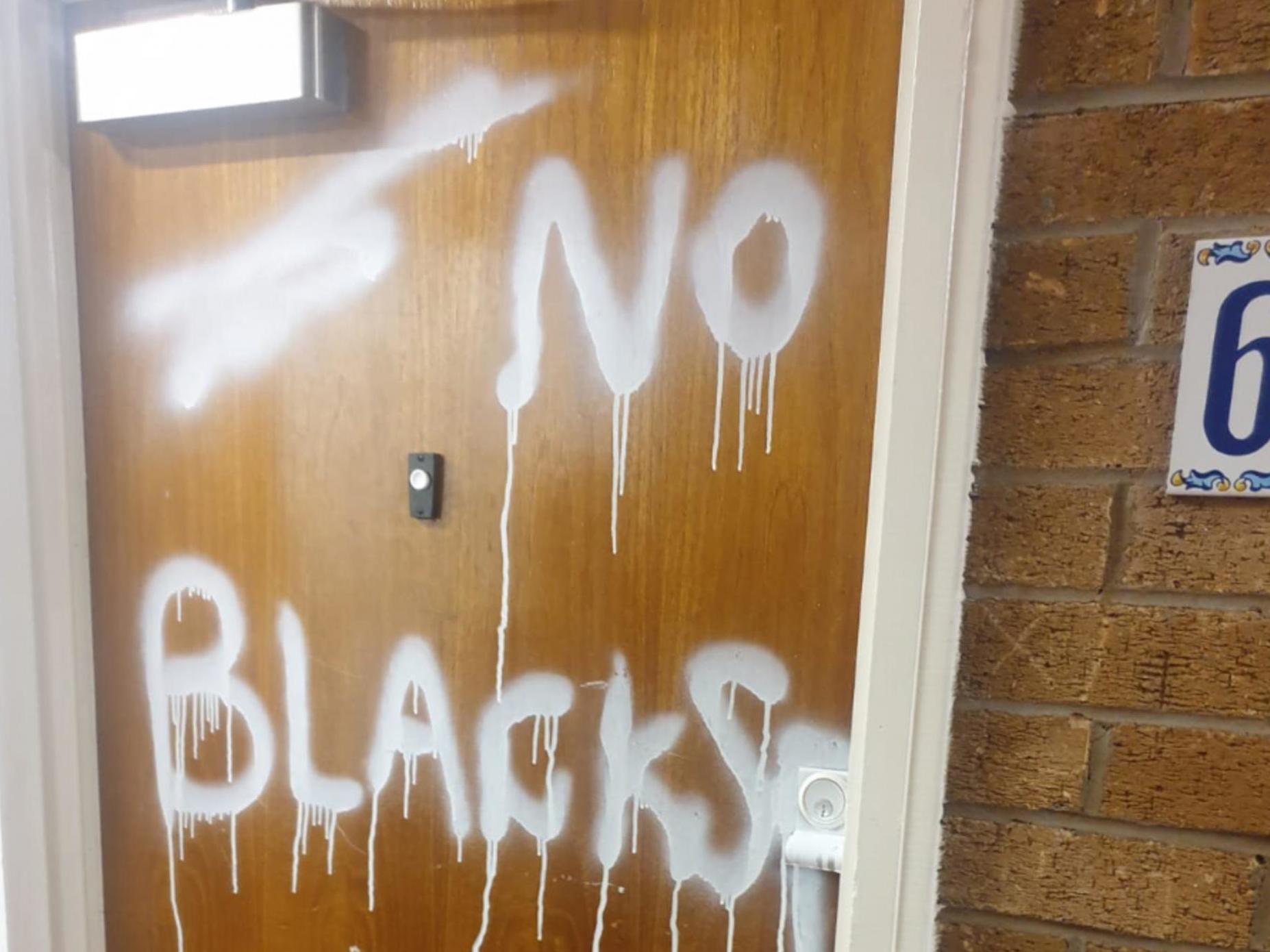The racist message was daubed on Jackson Yamba's front door five days after they moved into the flat in Salford