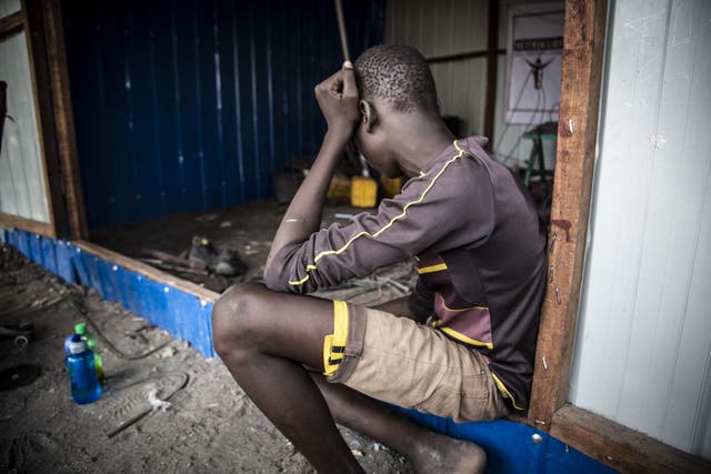 A former child soldier at a welding shop in Pibor where he is being trained