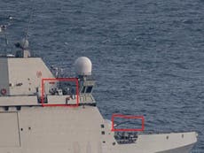 Spanish warship with guns manned orders boats in Gibraltar to leave