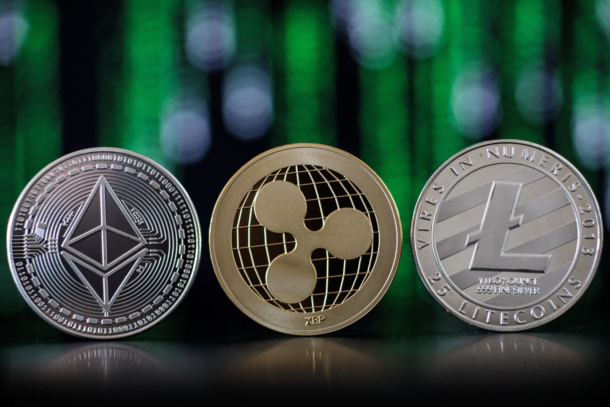 A photo illustration of the ethereum, ripple and litecoin cryptocurrency 'altcoins' on 25 April, 2018 in London, England