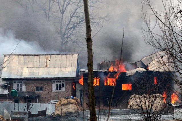 A house in which militants are suspected to have sheltered is in flames after a gunfight between rebels and security forces in south Kashmir's Pulwama district on 18 February 2019.
