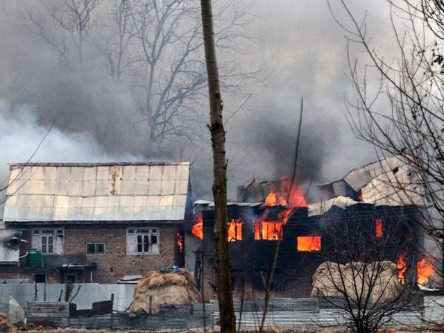 A house in which militants are suspected to have sheltered is in flames after a gunfight between rebels and security forces in south Kashmir's Pulwama district on 18 February 2019.