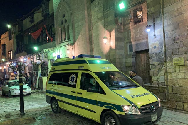 An ambulance arrives at the scene of an explosion behind a mosque near the Al-Azhar University