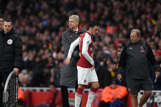 Arsene Wenger has questioned Mesut Ozil effort levels at Arsenal since signing his new contract