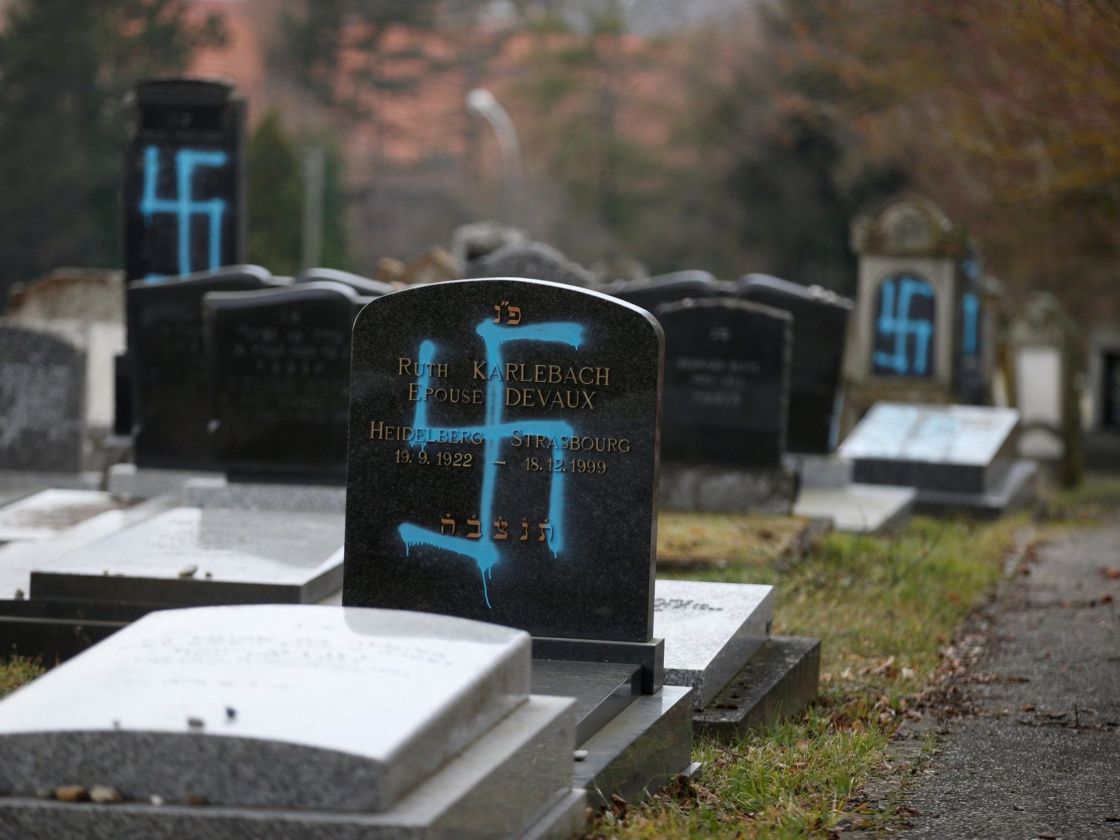 Graves desecrated with swastikas are seen in the Jewish cemetery in Quatzenheim, near Strasbourg, France