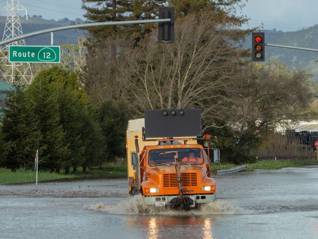 A truck navigates a flooded road in Schellville, California, USA.