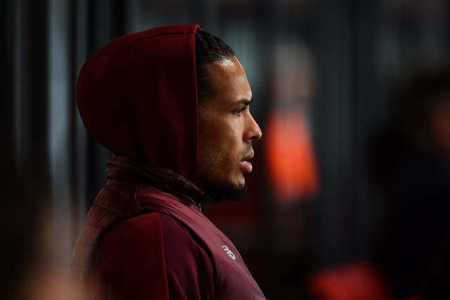 Virgil van Dijk watches on from the stands