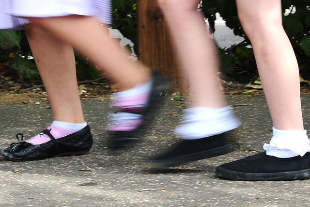 File photo date 15/07/14 of a generic stock photo of school girls walking to school