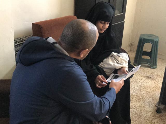 Shamima Begum being shown a copy of the Home Office letter which stripped her of her British citizenship by ITV News security editor Rohit Kachroo